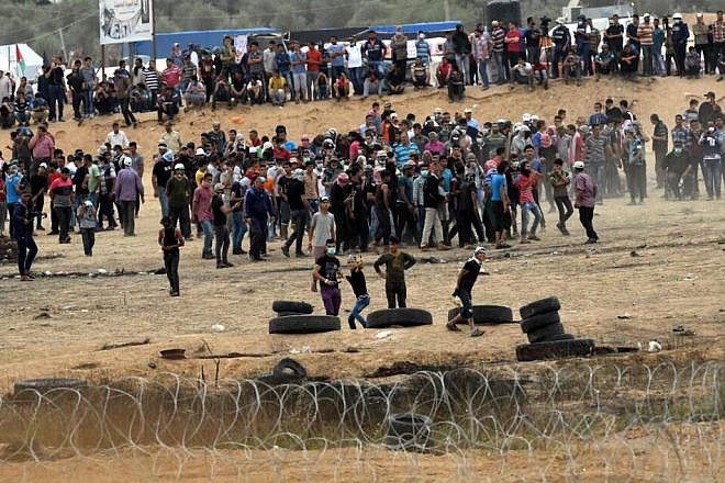 Gazans at the border with Israel during a “Great March of Return” riot, May, 4, 2018. Source: Wikimedia Commons.