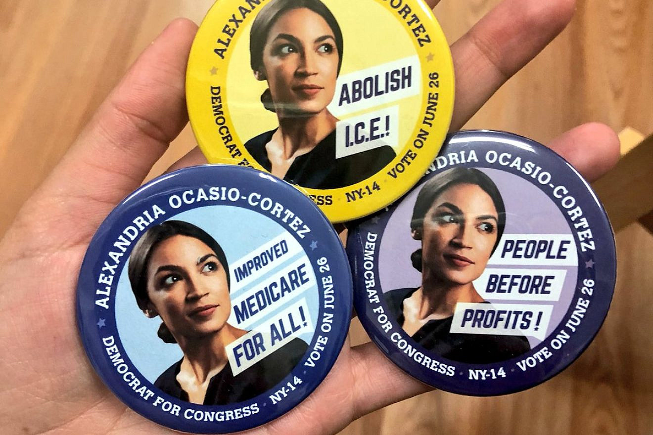 Campaign buttons for Alexandria Ocasio-Cortez, a Democratic Socialist who led a surprise upset victory over Rep. Joe Crowley (D-N.Y.) in a Democratic Party primary on June 27. Credit: Twitter.