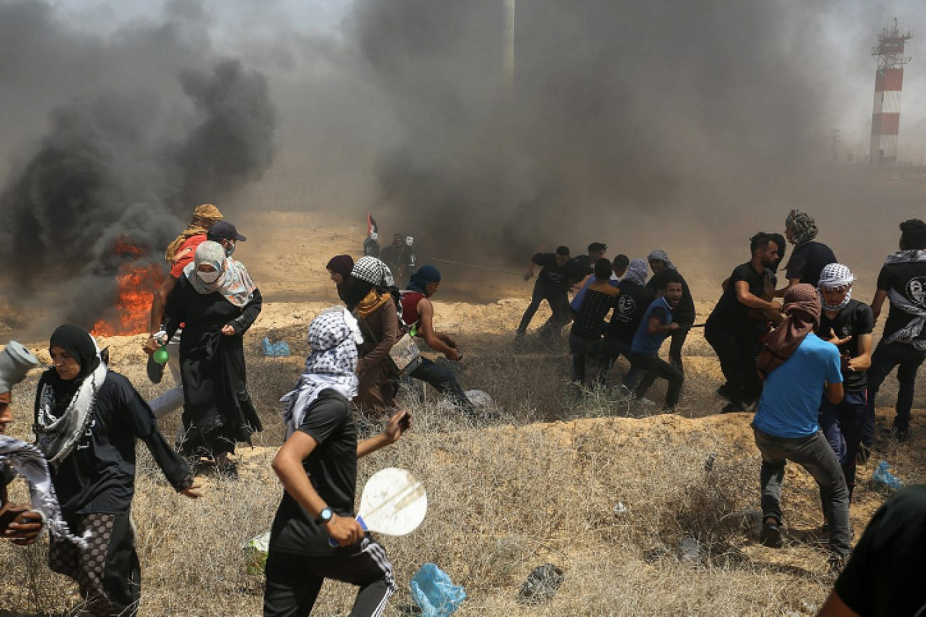 Palestinians burn tires during protests along the Gaza-Israel border fence commemorating the “Naksa” on June 8, 2018. Photo by Abed Rahim Khatib/Flash90.