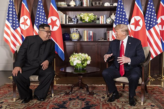 U.S. President Donald Trump and North Korean leader Kim Jong-un at the Capella Hotel in Singapore on June 12, 2018. Photo courtesy of White House via Wikimedia Commons.