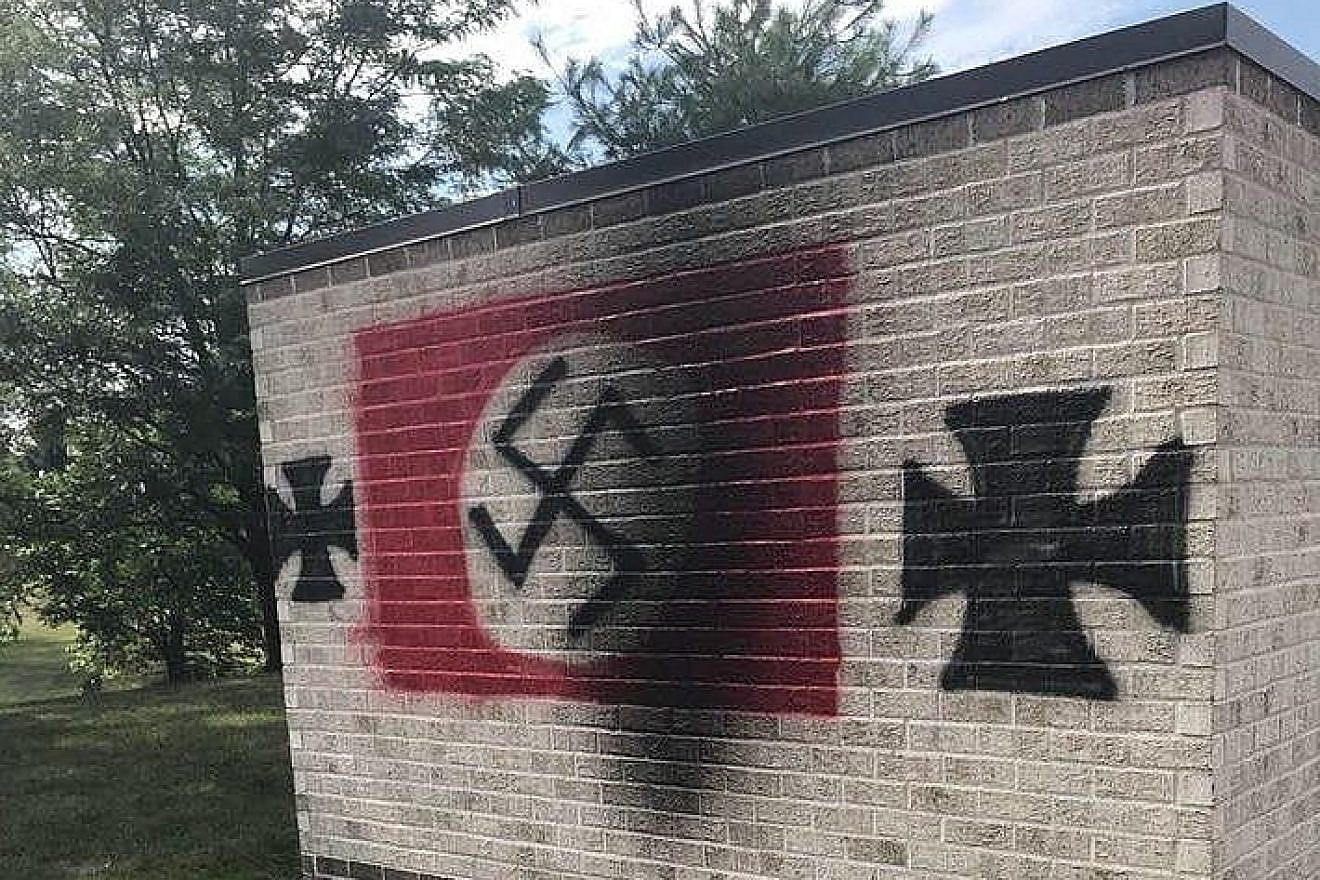 A Nazi swastika and iron crosses were spray-painted on Congregation Shaarey Tefilla in Carmel, Ind. Source: Debby Barton Grant/Facebook.