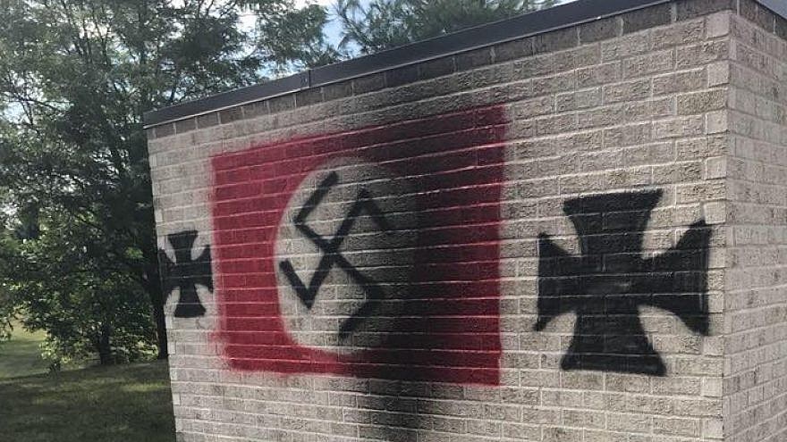 A Nazi swastika and iron crosses were spray-painted on Congregation Shaarey Tefilla in Carmel, Ind. Source: Debby Barton Grant/Facebook.