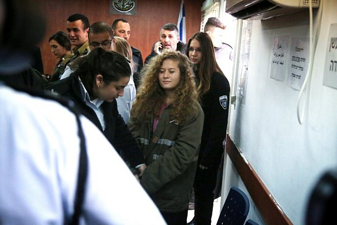 Palestinian Ahed Tamimi, 17, a well-known campaigner against Israel's occupation, arrives for the beginning of her trial in the Israeli military court at Ofer military prison in the West Bank village of Betunia on Feb. 13, 2018. She was charged after a viral video showed her beating and punching two IDF soldiers. The judge in the trial ordered journalists removed from the courtroom, ruling that open proceedings would not be in the interest of Tamimi, who is being tried as a minor. Photo by Flash90.