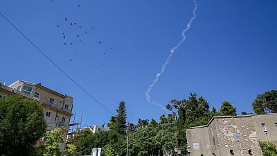 A smoke trail of a Patriot missile intercepted a drone approaching Israel from Syria in the northern Israeli city of Tzfat on July 11, 2018. Photo by David Cohen/Flash90.