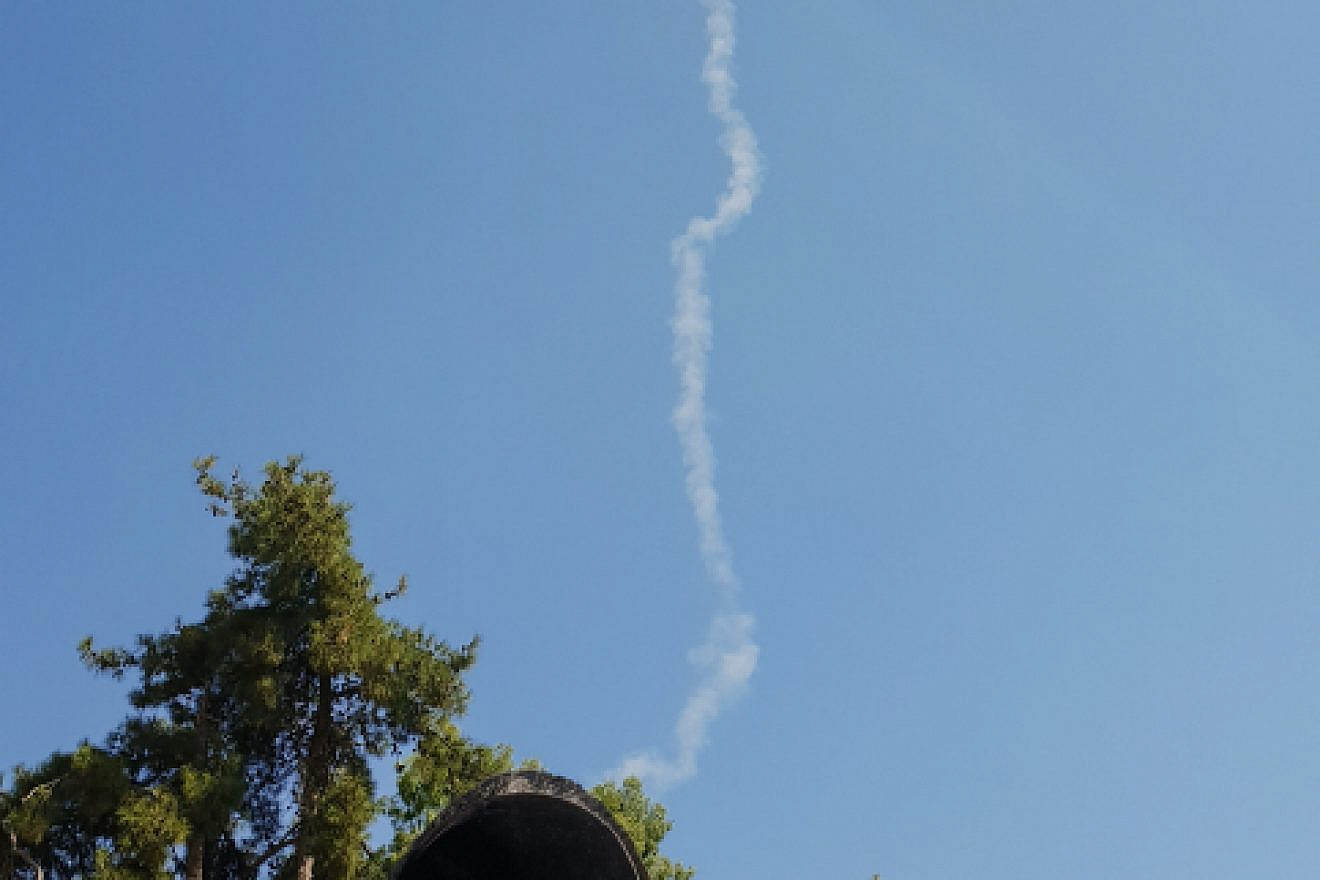 A smoke trail of the David’s Sling anti-missile system after two SS-21 missiles are fired from the Syrian side of the border over the northern Israeli city of Tzfat, July 23, 2018. Photo by David Cohen/Flash90.