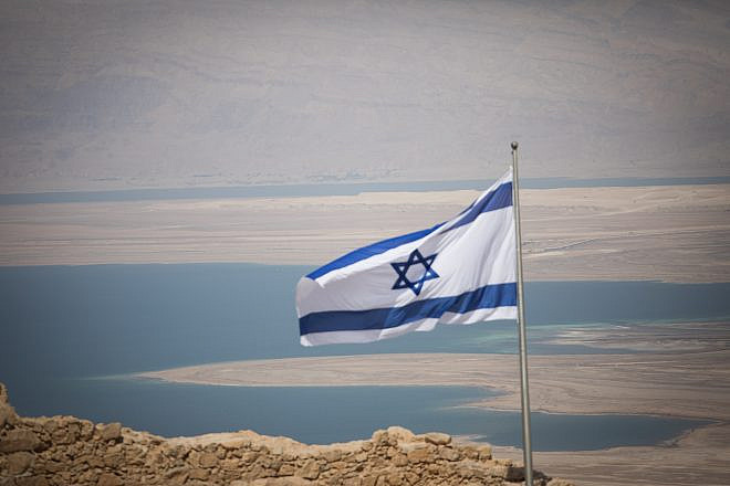 An Israeli flag on Masada, near the Dead Sea in southern Israel, on July 19, 2018. Photo by Yonatan Sindel/Flash90.