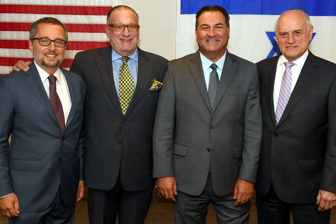 At Israel Bonds headquarters in New York are (from left) Arthur Stark, chairman of the Conference of Presidents of Major American Jewish Organizations; Howard Goldstein, board chairman of Israel Bonds; Israel Maimon, president and CEO of Israel Bonds; and longtime Conference of Presidents CEO Malcolm Hoenlein. Photo by Shahar Azran.