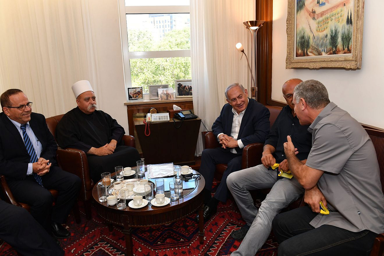 Israeli Prime Minister Benjamin Netanyahu meets with the leader of the Druze community in Israel, Sheikh Mowafaq Tarif (second from left), at the Prime Minister's Office in Jerusalem on July 27, 2018. Photo by Kobi Gideon/GPO.