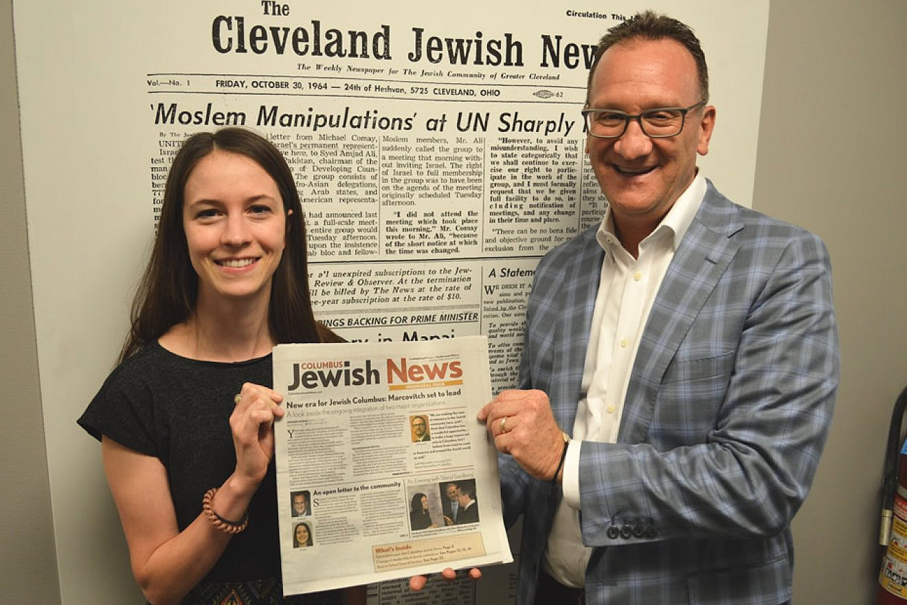 Columbus Bureau Chief Amanda Koehn and Kevin S. Adelstein, publisher and CEO, display the inaugural issue of the new biweekly “Columbus Jewish News,” which debuted on Aug. 9. Credit: “Columbus Jewish News.”