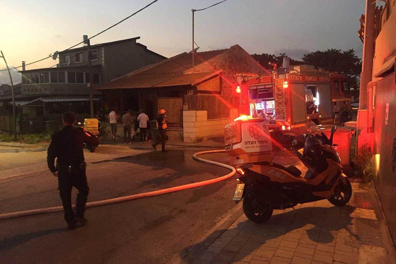 Israeli police and emergency service treat a man injured by rocket fire from Gaza in Sderot. Source: United Hatzalah via Twitter.