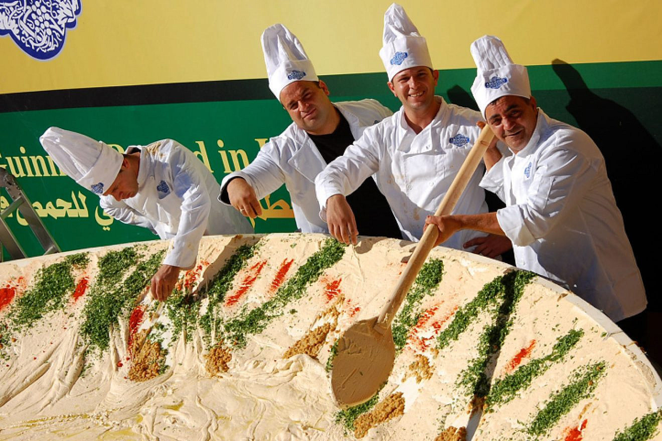Employees of the Abu Gosh restaurant prepare a 4-ton bowl of hummus with the goal of attaining the Guinness World Record title in 2010. The previous title owner was Lebanon, whose record was 2 tons of hummus.  Photo by Rachael Cerrotti/Flash 90.