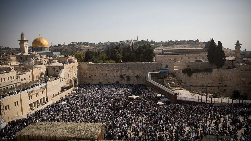 Jewish worshippers pray at the Western Wall in Jerusalem during the Cohen benediction priestly blessing during the holiday of Sukkot, Oct. 8, 2017. Photo by Yonatan Sindel/Flash90.