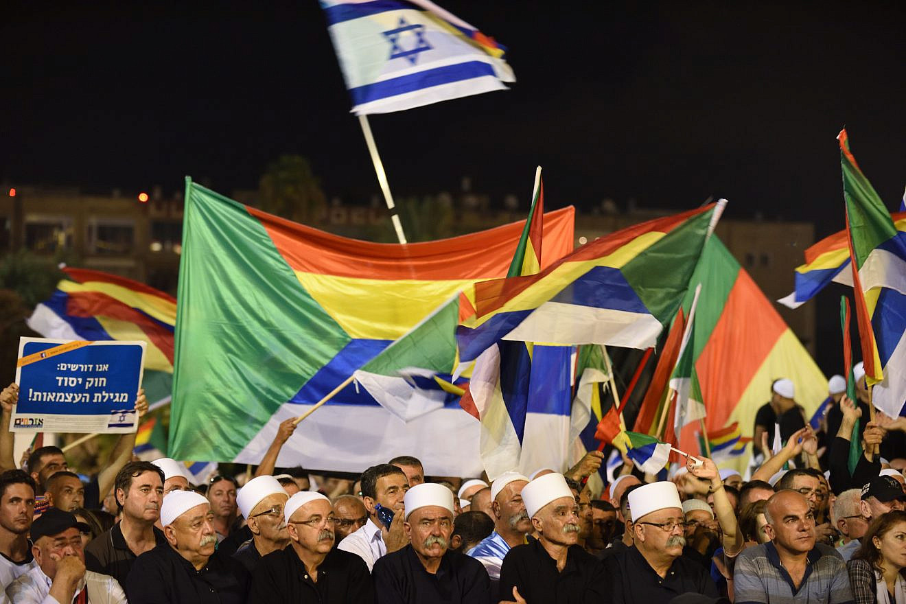 Israeli Druze attend a Druze-led rally to protest against the 'Jewish Nation-State law' in Rabin Square, Tel Aviv on Aug. 04, 2018. Tens of thousands of Israeli Druze and their supporters gathered in Tel Aviv on Saturday night to protest against the 'Jewish Nation-State' law. Photo by Gili Yaari /FLASH90