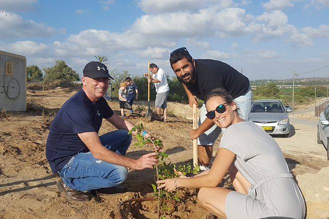 Israelis replant trees after arson attacks from the Gaza Strip in the summer of 2018. Credit: Kibbutz Erez.