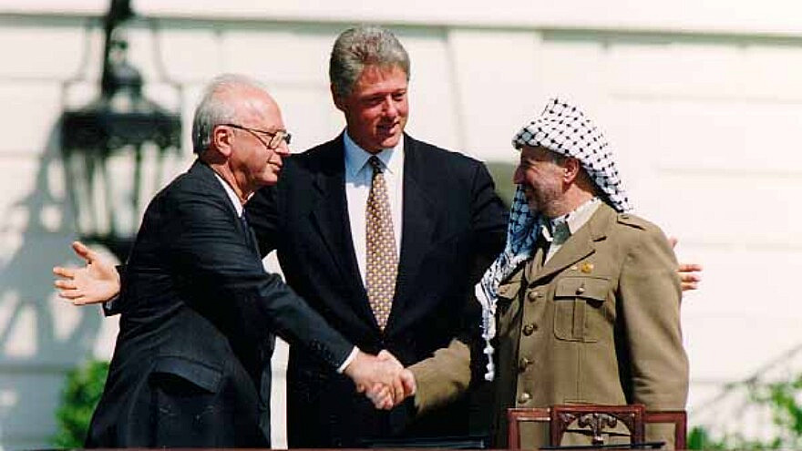 Israeli Prime Minister Yitzhak Rabin, U.S. President Bill Clinton and PLO head Yasser Arafat at the signing of the Oslo Accords on Sept. 13, 1993. Credit: Vince Musi/The White House.
