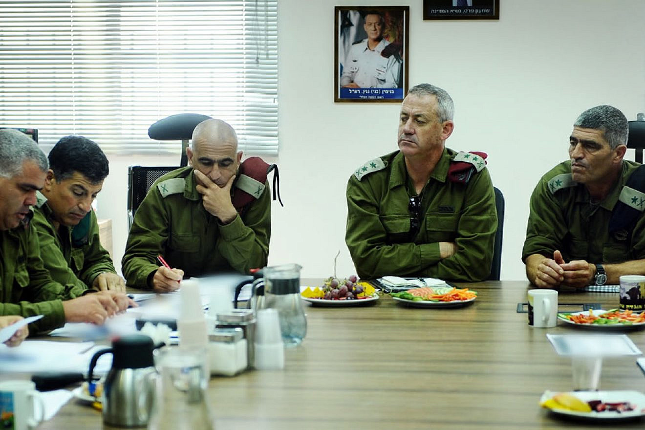 Israel Defense Forces Chief of Staff Lt. Gen. Benny Gantz (center) evaluates the security situation on a visit to the Southern Command and Gaza Division. The meeting was attended by commander of the Southern Command, Maj. Gen. Tal Russo (right), and IDF Spokesman Brig. Gen. Yoav Mordechai. Aug. 19, 2011. Credit: Flickr/Israel Defense Forces via Wilkimedia Commons.