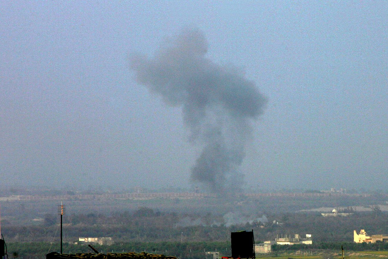 Smoke billows on the Egyptian side of the border, seen from Rafah in southern Gaza, following an explosion on Feb. 10, 2018. Egypt closed its border with the Gaza Strip, Palestinian officials said, after Cairo launched a major operation against jihadists in the Sinai Peninsula. Photo by Abed Rahim Khatib.