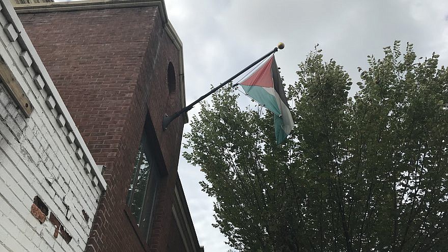 The Palestinian flag moments before being taken down from the PLO Mission in Washington in advance of its being ordered closed by the Trump administration, Oct. 10, 2018. Credit: Jackson Richman/JNS.
