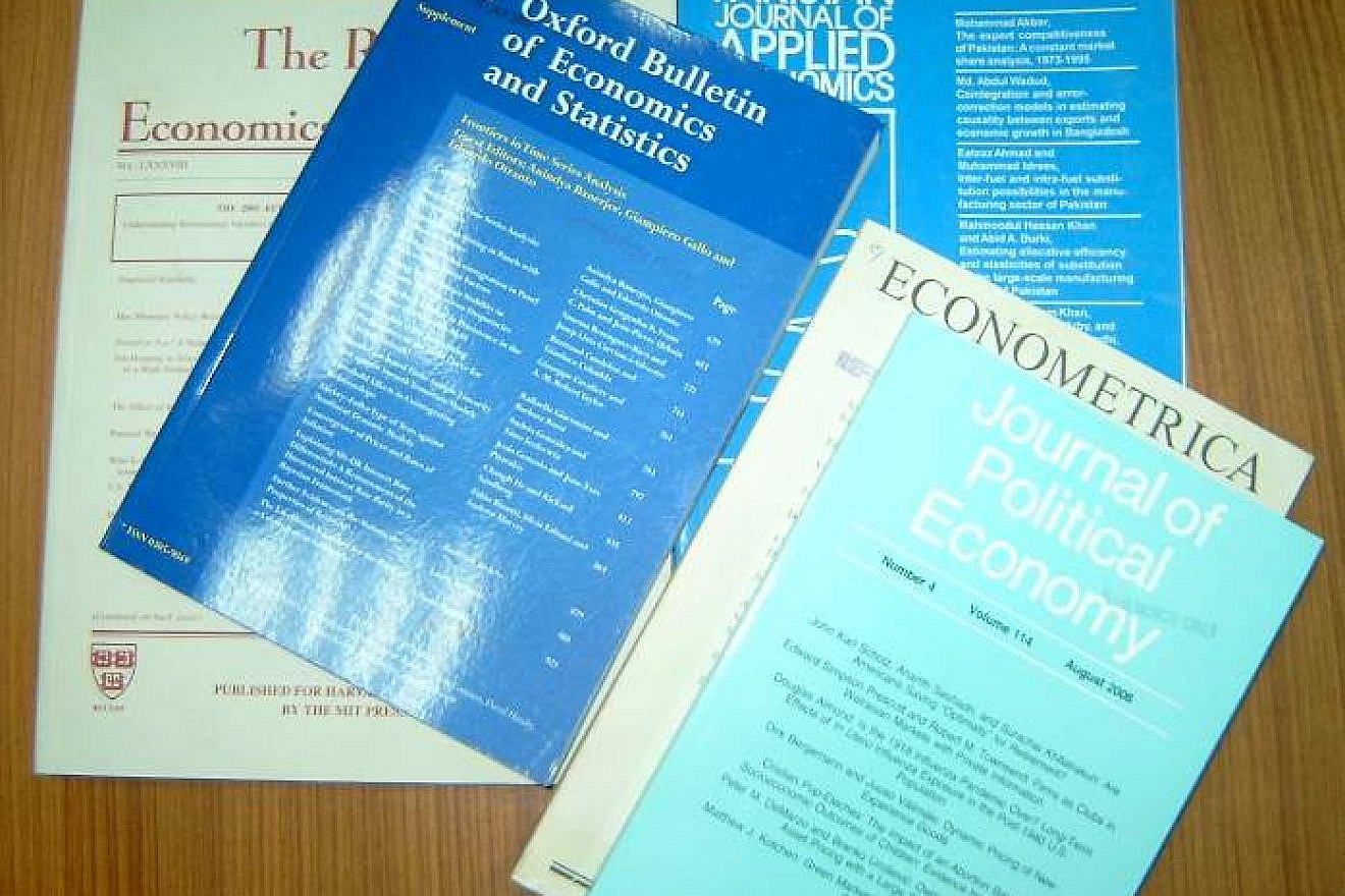 Different types of peer-reviewed research journals; these specific publications are about economics. Credit: Wikimedia Commons.