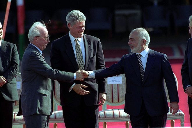 U.S. President Bill Clinton is flanked by Jordan's King Hussein and Israeli Prime Minister Yitzhak Rabin, shaking hands in October 1994. Source: Israel Government Press Office.