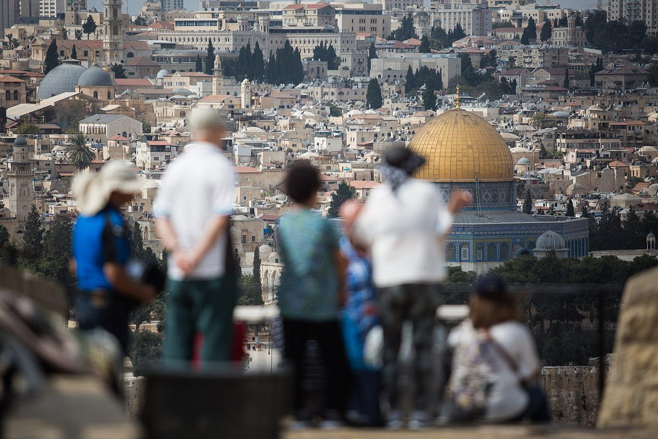 Tourists take in the view of the Dome of the Rock and Temple Mount from the Mount of Olives platform overlooking the Old City of Jerusalem, on Oct. 11, 2018. Photo by Hadas Parush/Flash90.