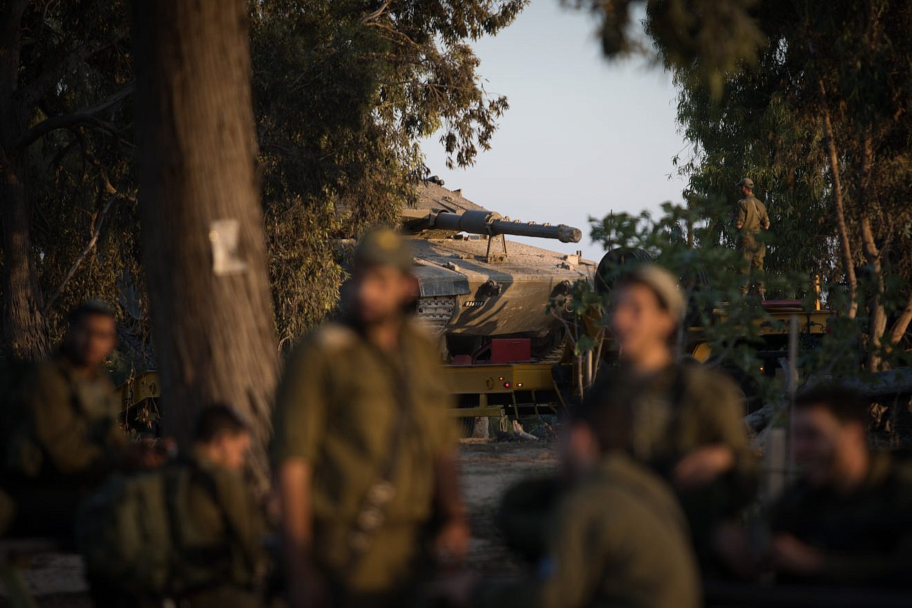 Israeli soldiers rest close to Kibbutz Nir Oz in southern Israel, near the border with Gaza. An Israeli army officer and seven Palestinians, including a local Hamas commander, were killed following an incursion by Israeli special forces into the Gaza Strip. Nov. 12, 2018. Photo by Hadas Parush/Flash90.