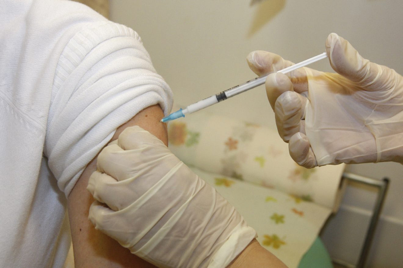 A patient receiving a vaccine. Photo: Miriam Alster/Flash90.