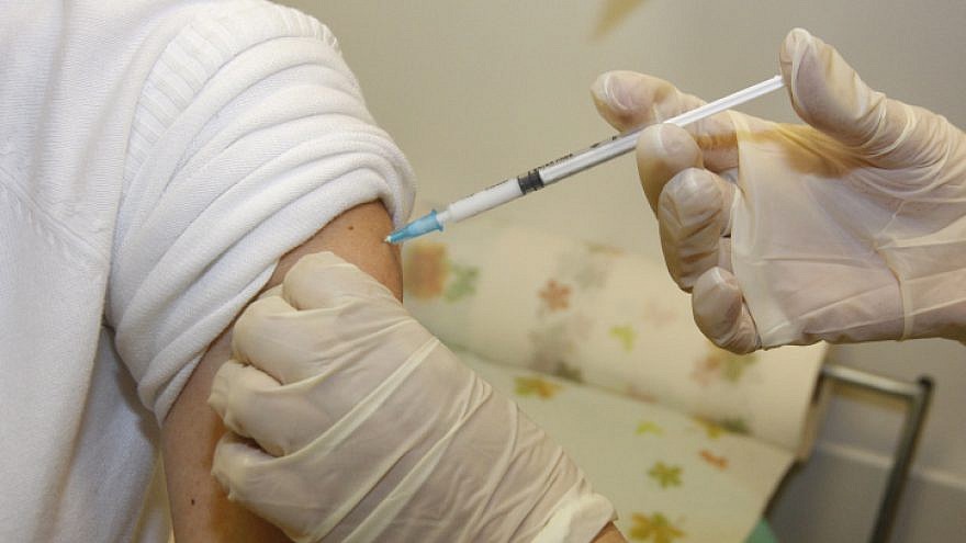 A patient receiving a vaccine. Photo: Miriam Alster/Flash90.