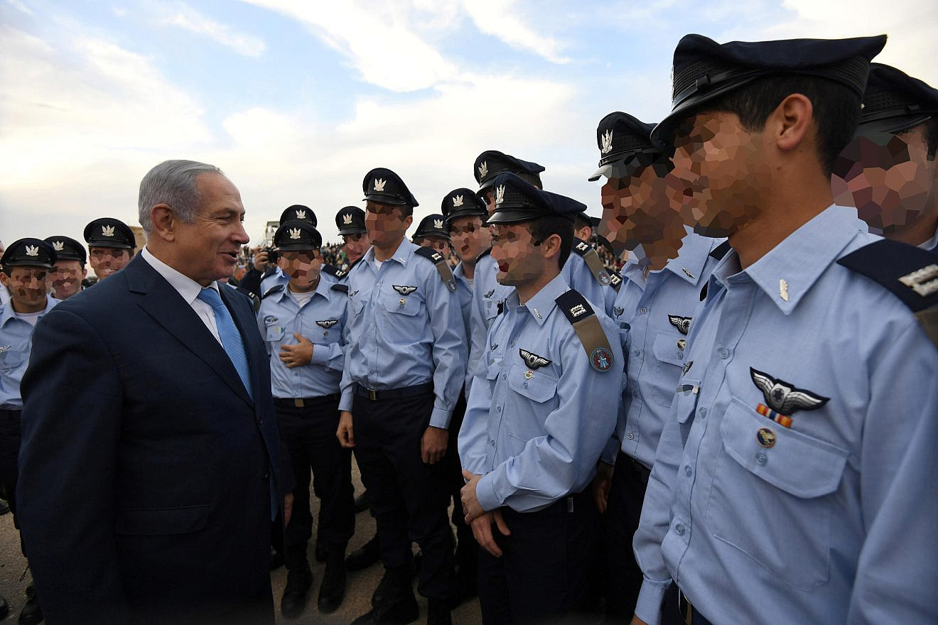 Israeli prime minister Benjamin Netanyahu attends an aerial show at a graduation ceremony for soldiers who have completed the IAF Flight Course, at the Hatzerim Air Base in the Negev desert, December 27, 2017. Credit: Haim Zach/GPO