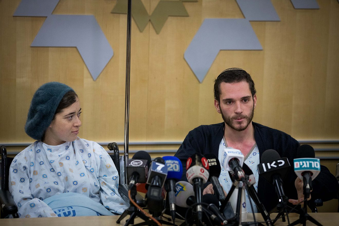 Shira and Amichai Ish-Ran, who were injured in a drive-by shooting on Dec. 9, 2018 when a Palestinian opened fire on Israelis near the settlement of Ofra, answer questions at a press conference at Shaare Zedek Medical Center on Dec. 16, 2018. Shira was 30 weeks pregnant at the time of the attack. Their baby son was delivered by an emergency Caesarean section, but died a few days later. Credit: Yonatan Sindel/Flash90.