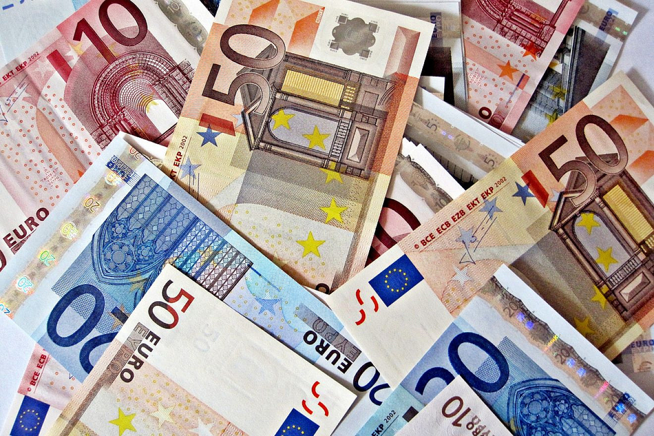 A large pile of Euro currency. Credit: Images Money/Flickr.