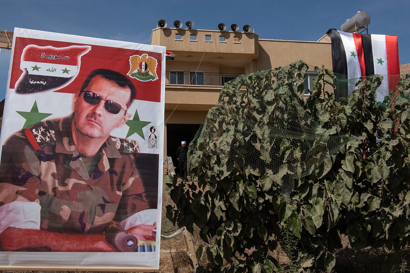 A poster of Syrian President Bashar Assad, Oct. 6, 2018. Photo by Basel Awidat/Flash90.