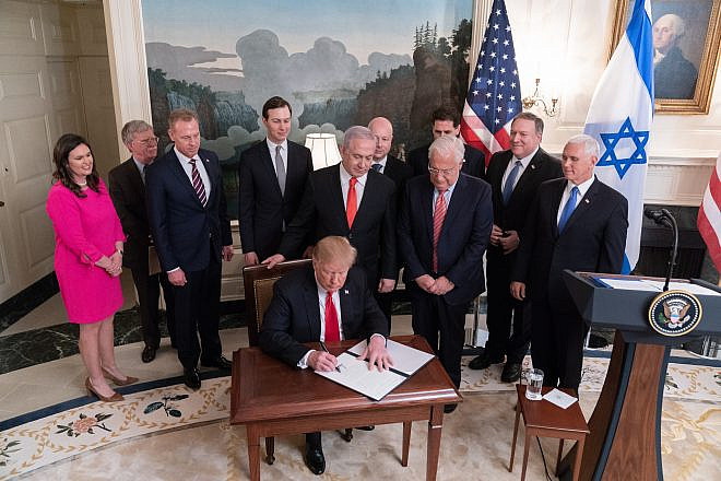 U.S. President Donald Trump, joined by Israeli Prime Minister Benjamin Netanyahu and administration officials, signs a proclamation formally recognizing Israel’s sovereignty over the Golan Heights, on March 25, 2019, at the White House. Credit: Official White House Photo by Shealah Craighead.