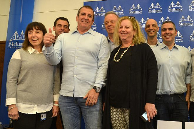 Eyal Waldman, president of Mellanox Technologies, with others at the company during a press conference in Tel Aviv on March 11, 2019. Photo by Flash90.