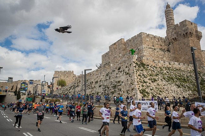 Thousands of runners take part in the 2019 international Jerusalem Marathon in the Old City on March 15, 2019. Credit: Yonatan Sindel/Flash90.