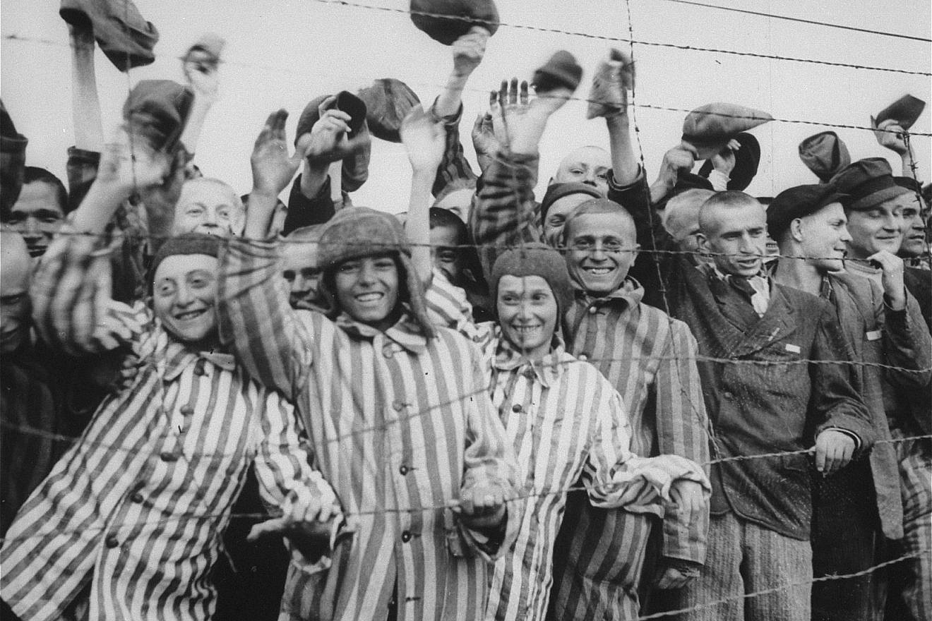 Survivors at the Dachau concentration camp cheer their liberation by U.S. soldiers. Credit: United States Holocaust Memorial Museum, Courtesy of National Archives and Records Administration, College Park, Md.