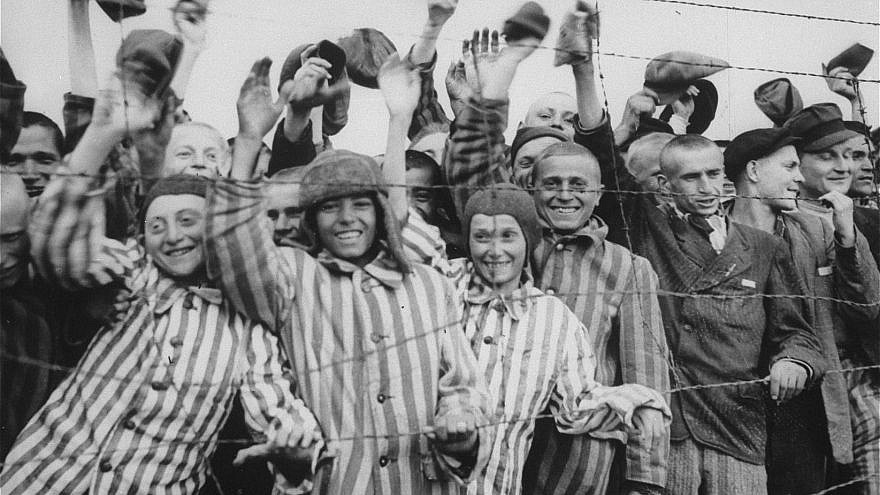 Survivors at the Dachau concentration camp cheer their liberation by U.S. soldiers. Credit: United States Holocaust Memorial Museum, Courtesy of National Archives and Records Administration, College Park, Md.
