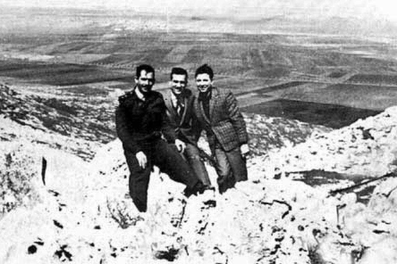 Eli Cohen (in the middle) posing as Arab merchant Kamel Amin Thaabet, with his friends from the Syrian army on the Golan Heights overlooking Israel, mid-1960s. Credit: Syrian military personnel photo via Wikimedia Commons.