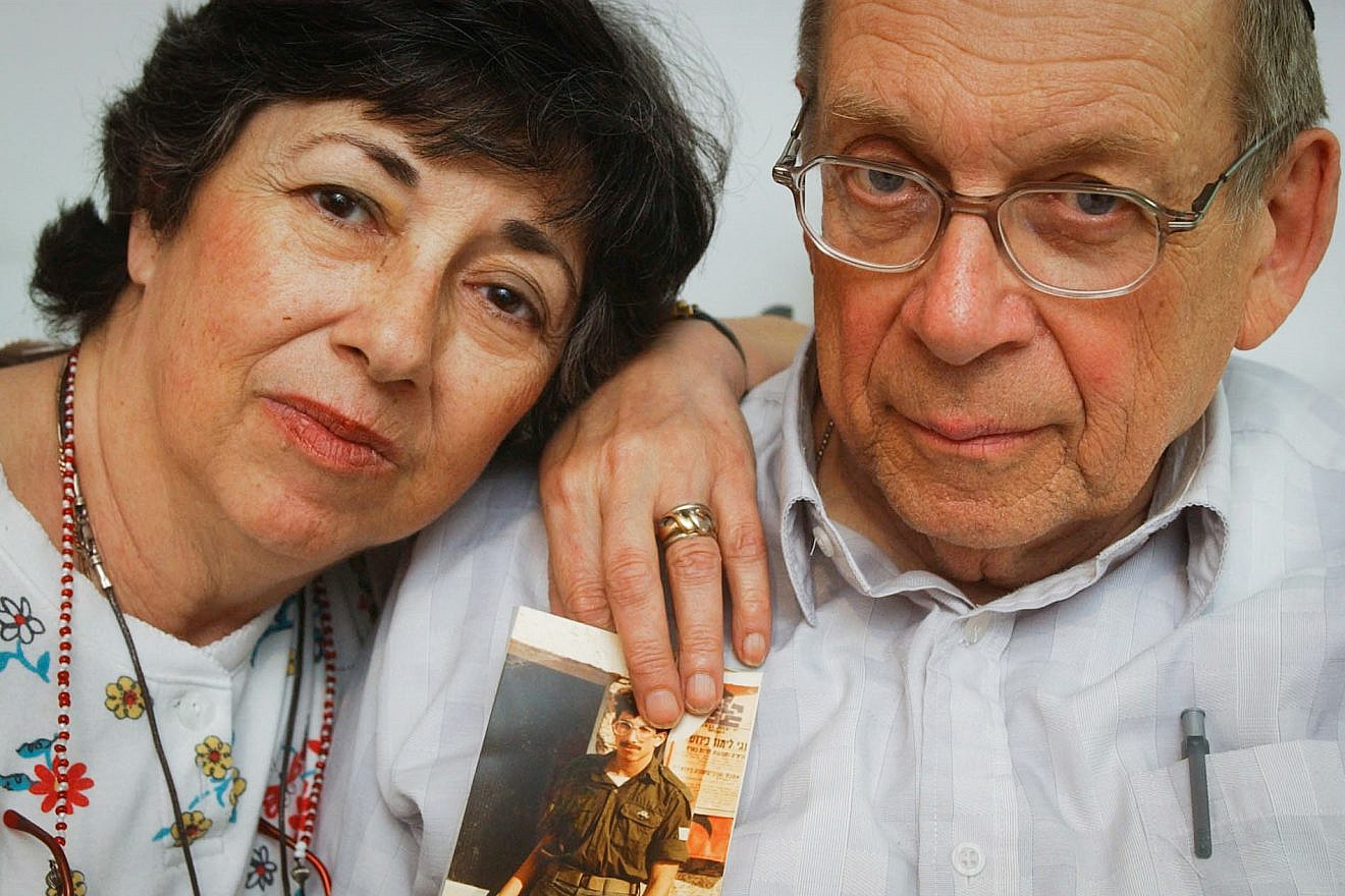 Miriam and Yoni Baumel hold a picture of their son, Zachary Baumel, who went missing in the Battle of Sultan Yacoub in 1982, in Jerusalem on July 7, 2003. Photo by Flash90.