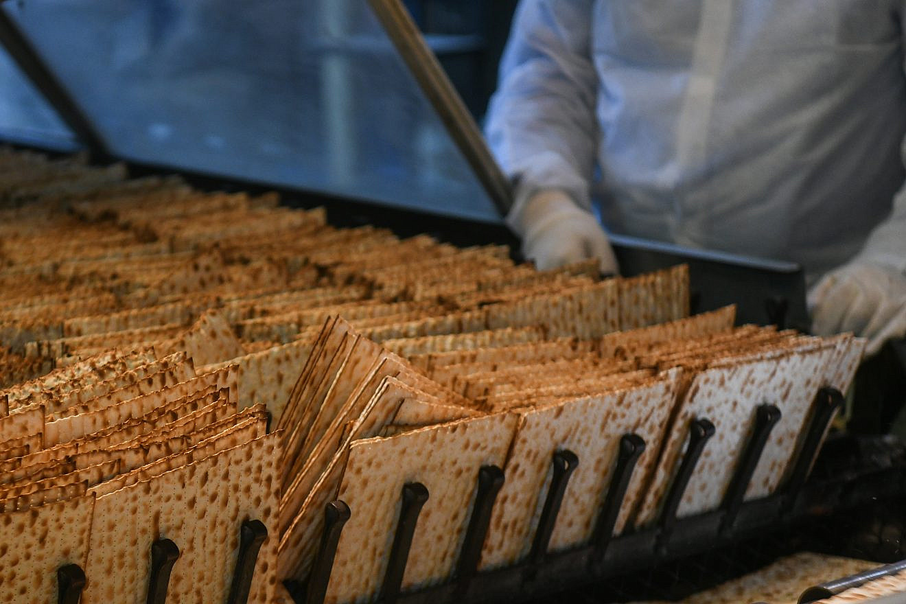 Workers prepare matzah ahead of the Passover holiday at the Aviv matzah plant in Bnei Brak on April 14, 2019. Photo by Flash90.