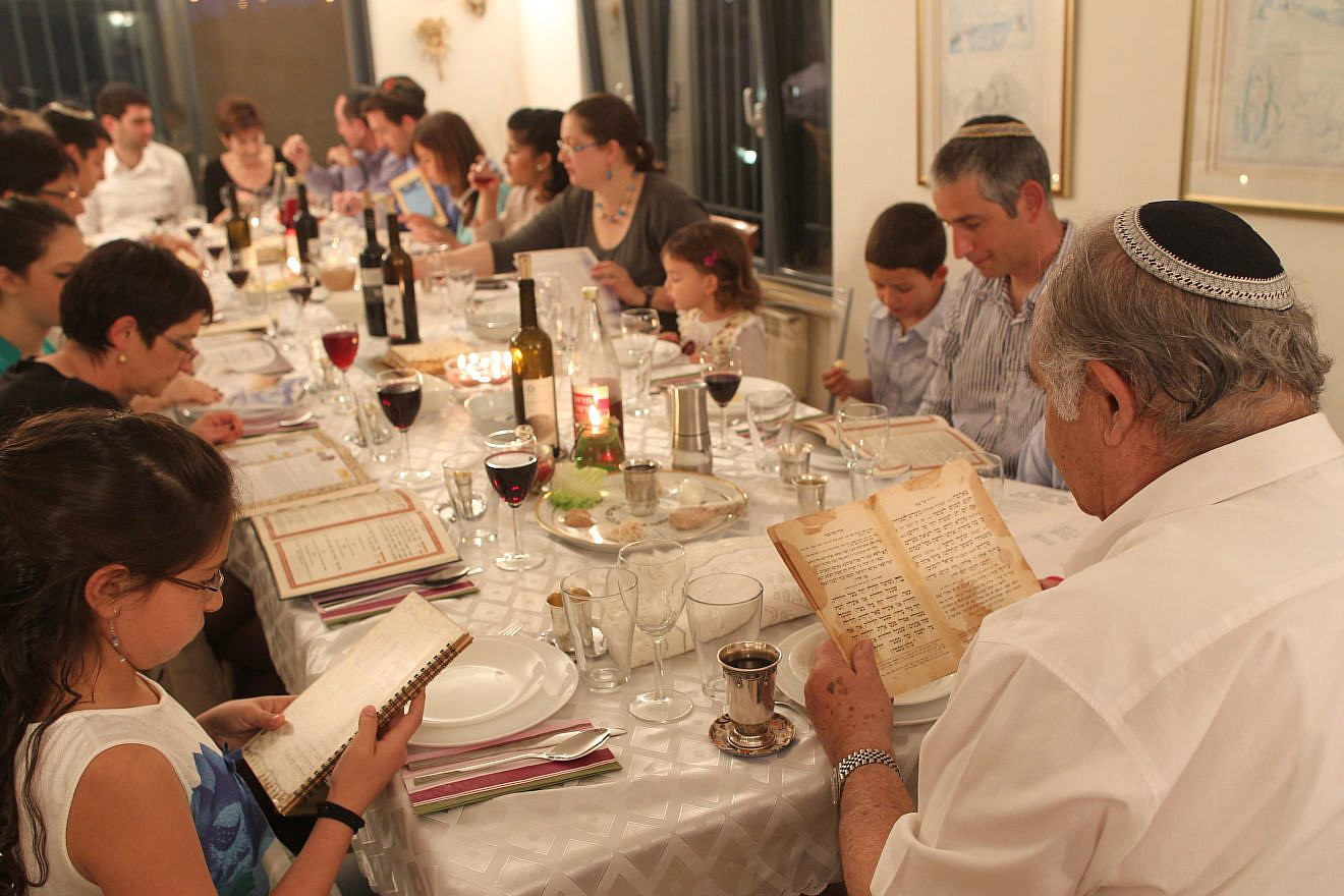 An Israeli family during the Passover seder on the first night of the holiday in Tzur Hadassah. Credit: Nati Shohat/Flash90.