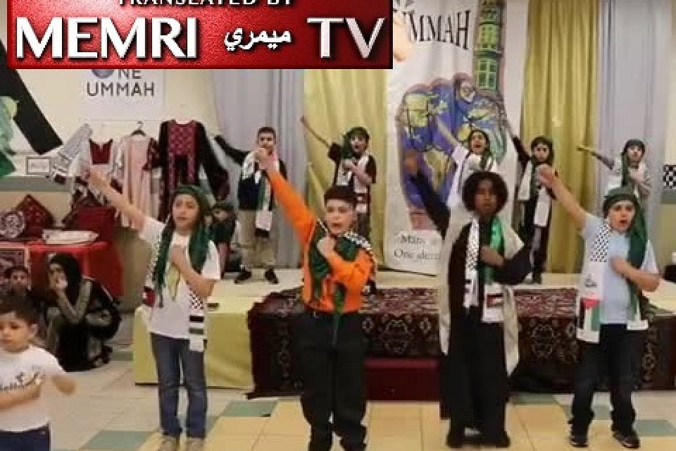 A still shot from a video posted on Facebook by the Muslim American Society Islamic Center in Philadelphia. In the video, young children wearing Palestinian scarves sing and read poetry about killing for Allah and the Al-Aqsa mosque. (MEMRI)