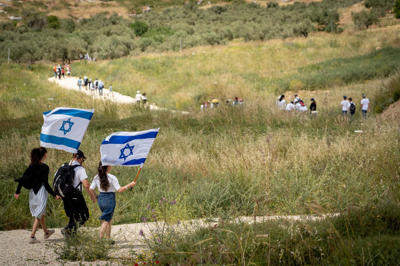 Israelis participate in a march to celebrate Israel's 71st Independence Day near Havat Gilad in Judea and Samaria on May 9, 2019. Photo by Hillel Maeir/Flash90.