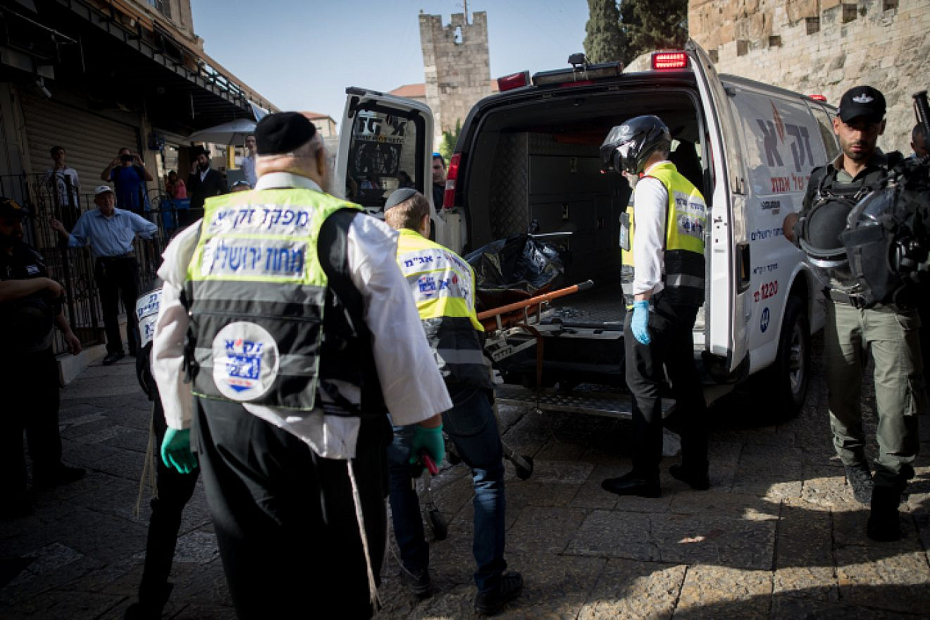 Israeli security forces and medics remove the body of a Palestinian man who stabbed two Israelis in the Old City of Jerusalem, on May 31, 2019. The attack occurred as Muslims marked the last Friday of the month of Ramadan. Photo by Yonatan Sindel/Flash90.