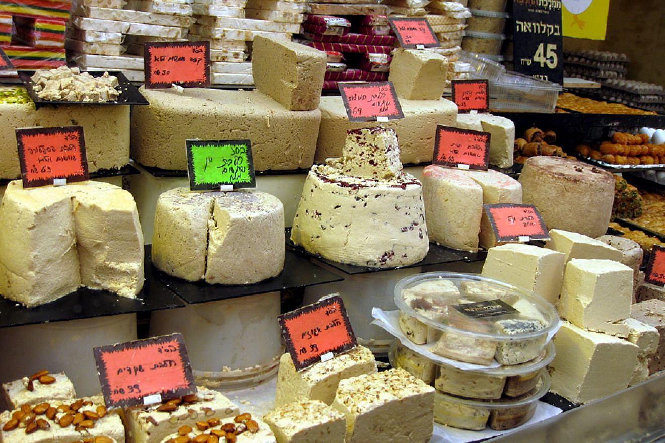 An array of the many types of halvah at a stand in the Machane Yehuda outdoor market in Jerusalem. Credit: Avi Deror via Wikimedia Commons.