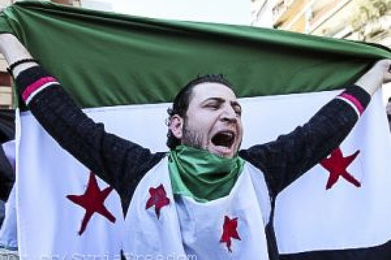 Anti-Syrian regime protester chants slogans against Syrian President Bashar Assad. Credit: Freedom House via Flickr.
