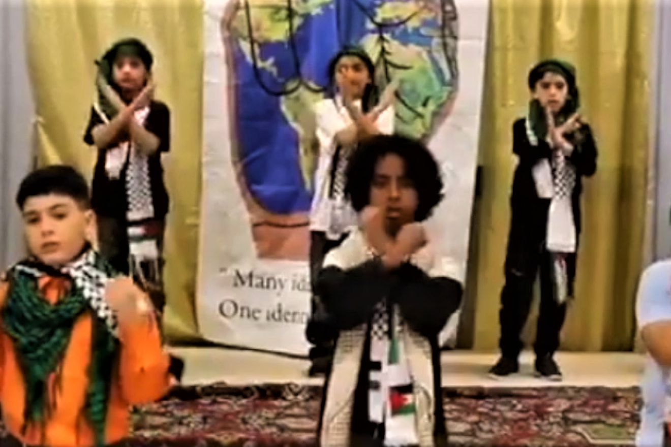 A still shot from a video posted on Facebook by the Muslim American Society Islamic Center in Philadelphia showing young children wearing Palestinian scarves while singing and reading poetry about killing for Allah and the Al-Aqsa mosque. in Jerusalem. Source: Screenshot.