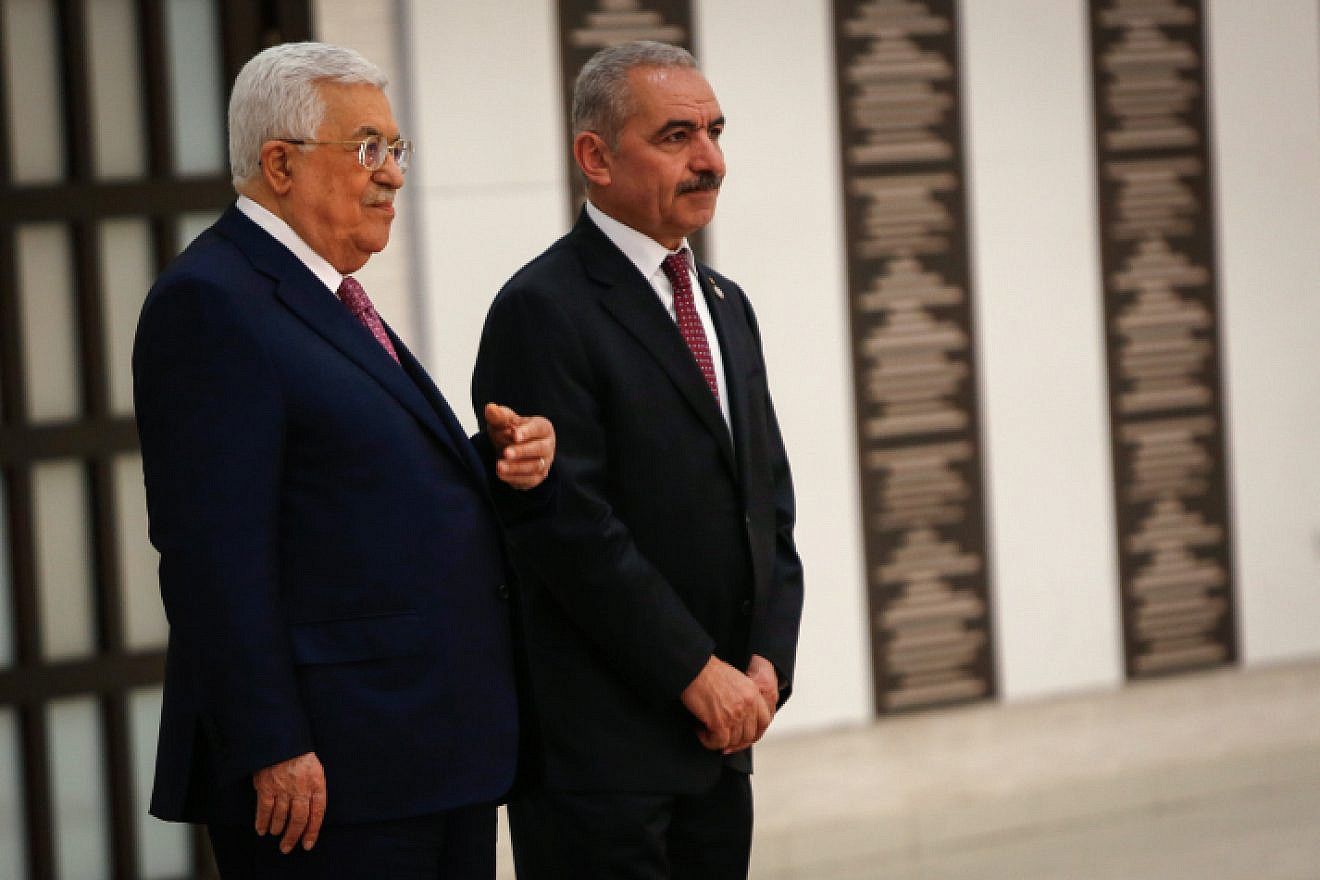 Palestinian Authority leader Mahmoud Abbas (left) and P.A. Prime Minister Mohammad Shtayyeh at the swearing-in ceremony of the new government at the P.A.'s headquarters in Ramallah, April 13, 2019. Photo by Nasser Ishtayeh/Flash90.
