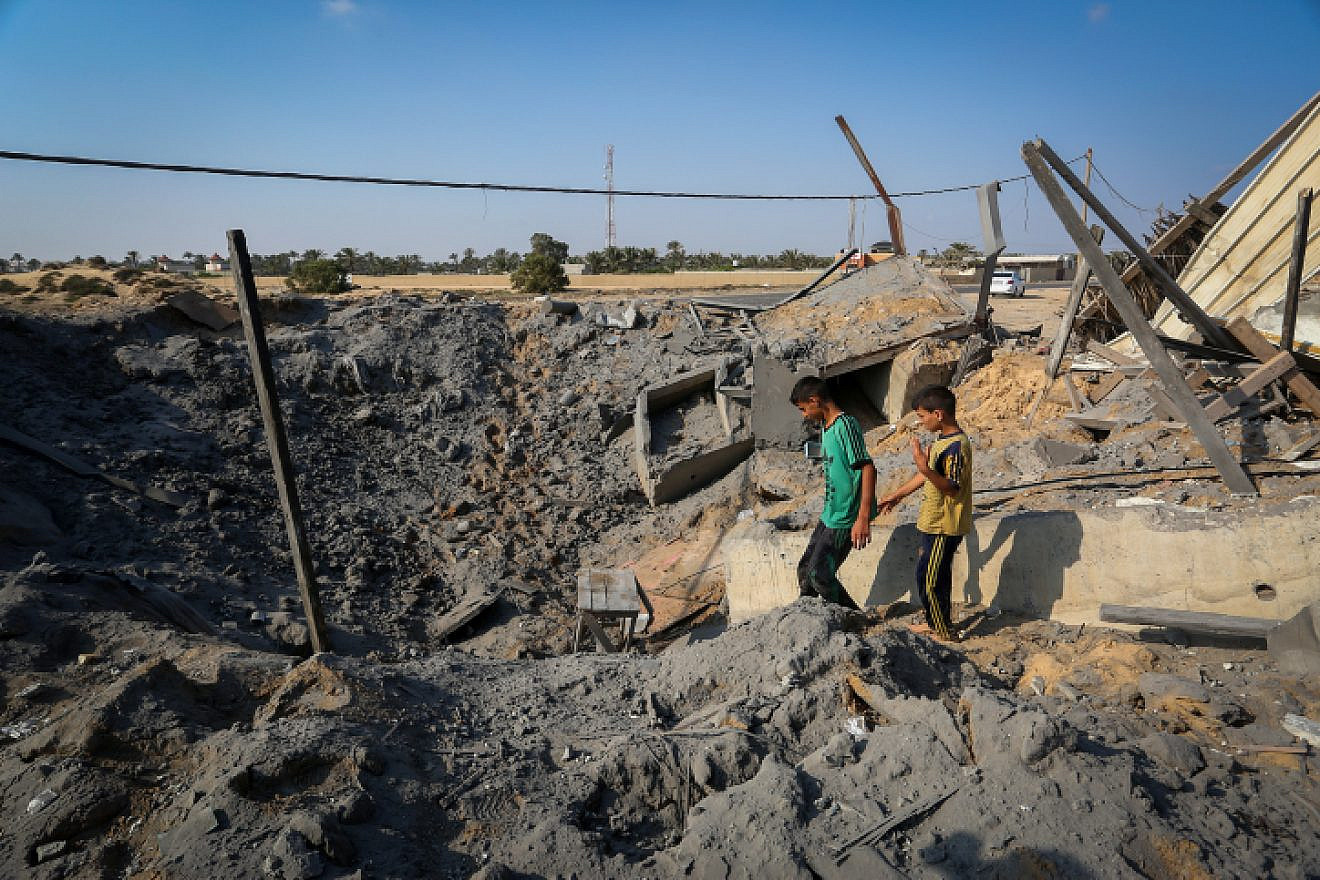 Palestinians inspect the damage after Israeli airstrike overnight in Khan Yunis in the southern Gaza Strip, on June 14, 2019. Photo by Abed Rahim Khatib/Flash90.