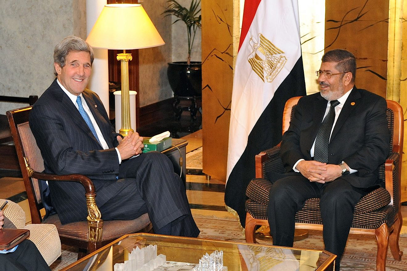 U.S. Secretary of State John Kerry meeting with former Egyptian President Mohamad Morsi in 2013. Credit: Wikimedia Commons.